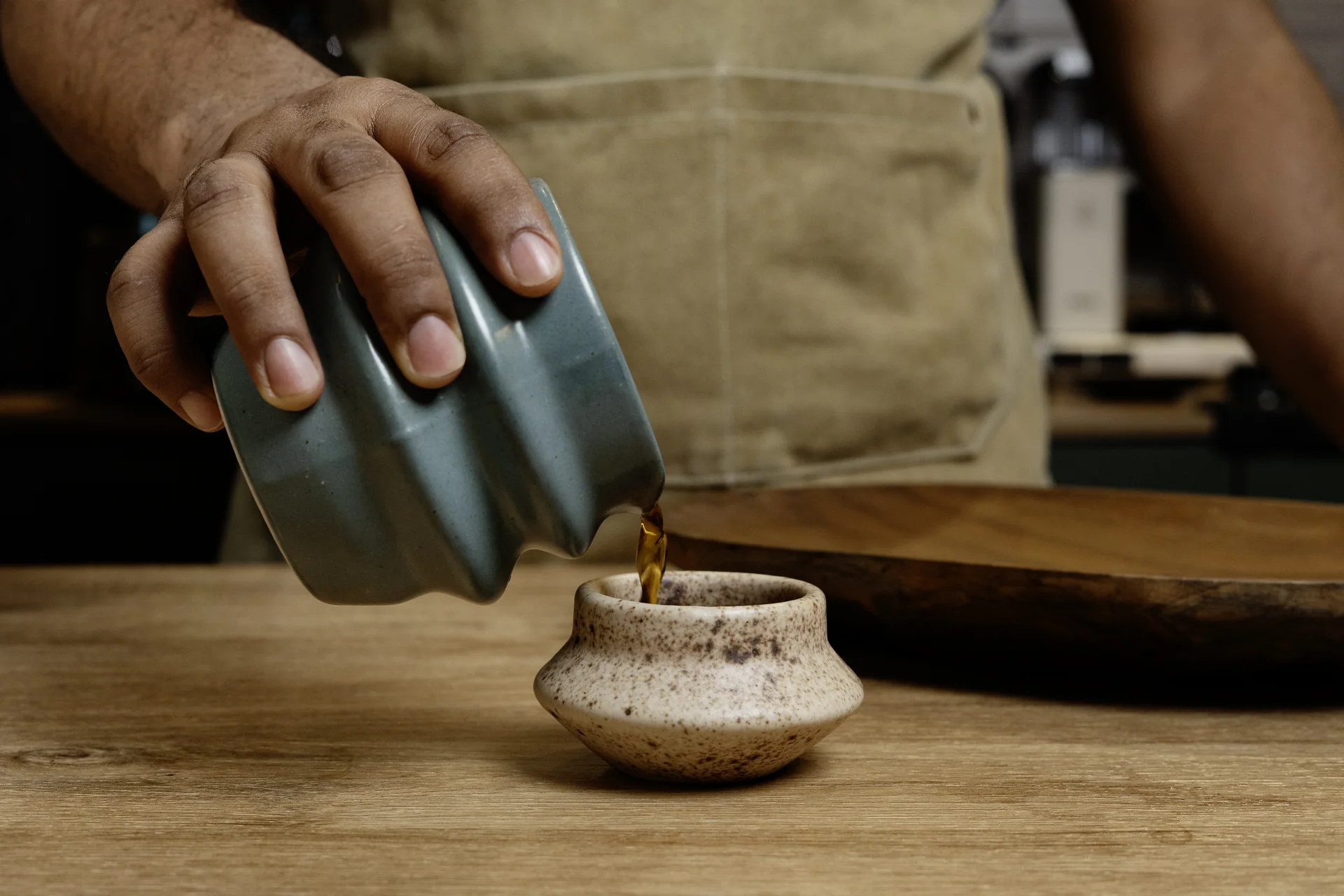Coffee poured from a ceramic pot at La Pandora Coffee